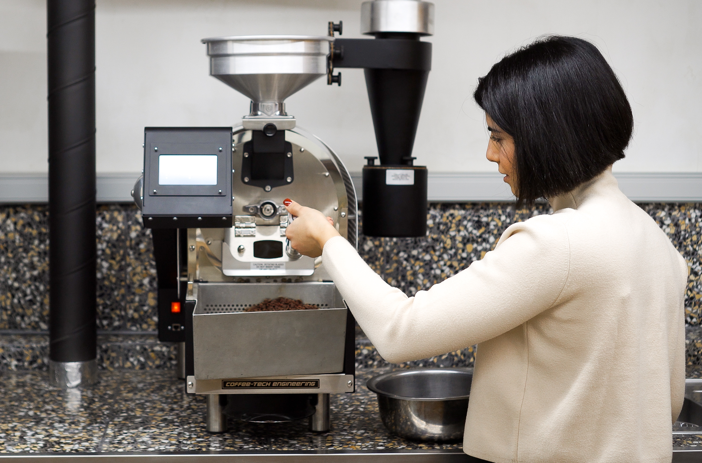 Coffee-Tech Engineering Solar Eco coffee roaster installed on a café countertop, operated by café staff